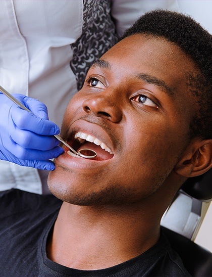 man getting a dental checkup in Fort Smith