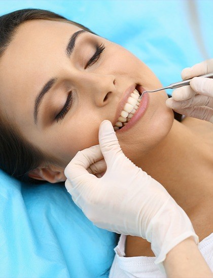 woman being examined by dentist for gum disease