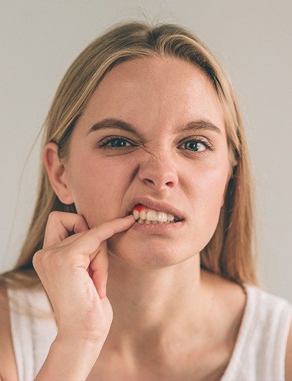 girl with red gums before gum disease treatment in Fort Smith