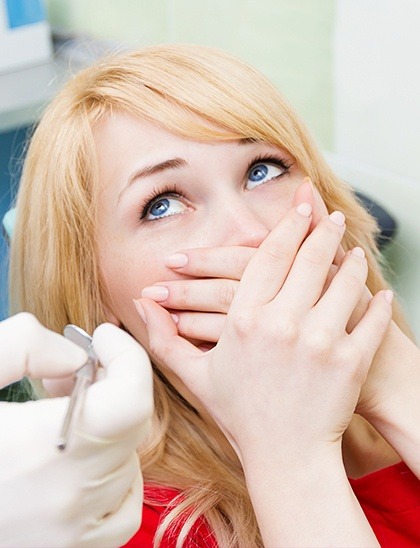 woman looking scared in the dental chair before sedation dentistry in Fort Smith