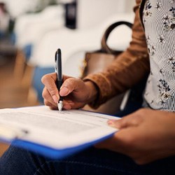 Woman filling out a dental insurance form