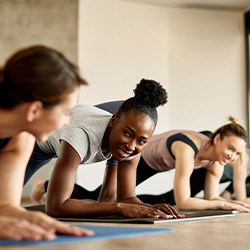 Group of women smiling during workout class