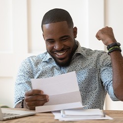 Patient in Fort Smith smiling after affordable root canal treatment