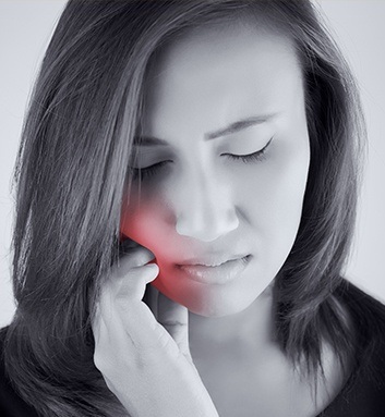 woman with red cheek in pain