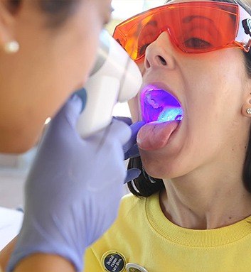 woman getting oral cancer screening