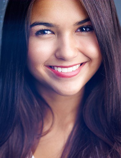 Young woman smiling after cosmetic dentistry in Fort Smith