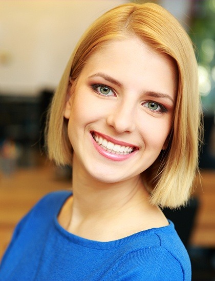 blonde woman smiling with dental crowns in Fort Smith