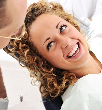 woman smiling up at dentist