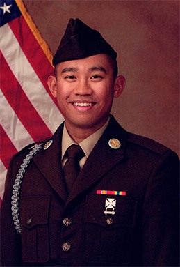 Smiling young man in his United States Army uniform