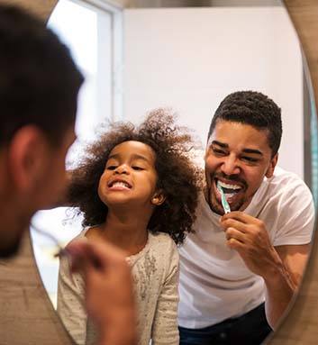 Family members brushing teeth