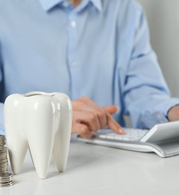 A patient calculating the cost of their dental care