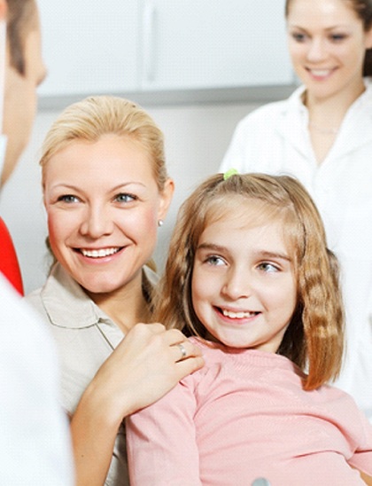 girl and mother at dentist
