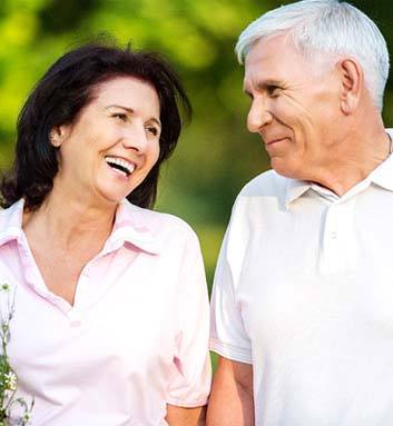 Older man and woman smiling