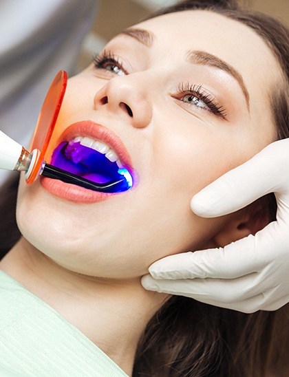 Woman receiving dental treatment