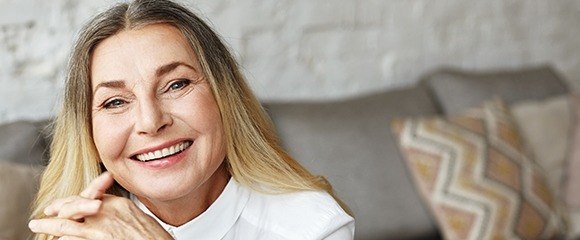 Smiling woman sitting on couch