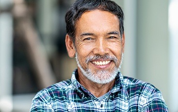 man with beard smiling