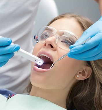 dentist using intraoral camera