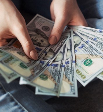 Woman’s hands holding cash