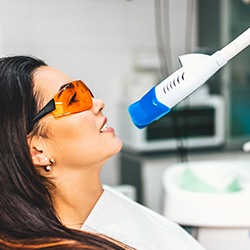 A woman receiving in-office teeth whitening