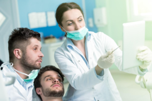 Two dentists discussing treatment