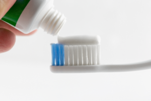 toothpaste applied to toothbrush