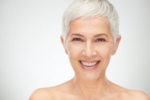 older woman smiling with white teeth