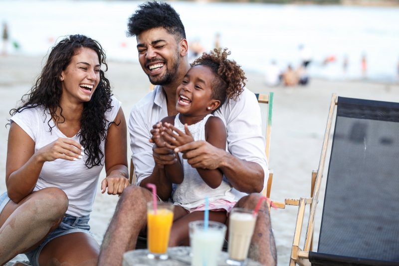 family laughing together on summer vacation