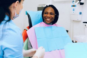 Smiling woman in dentist’s chair